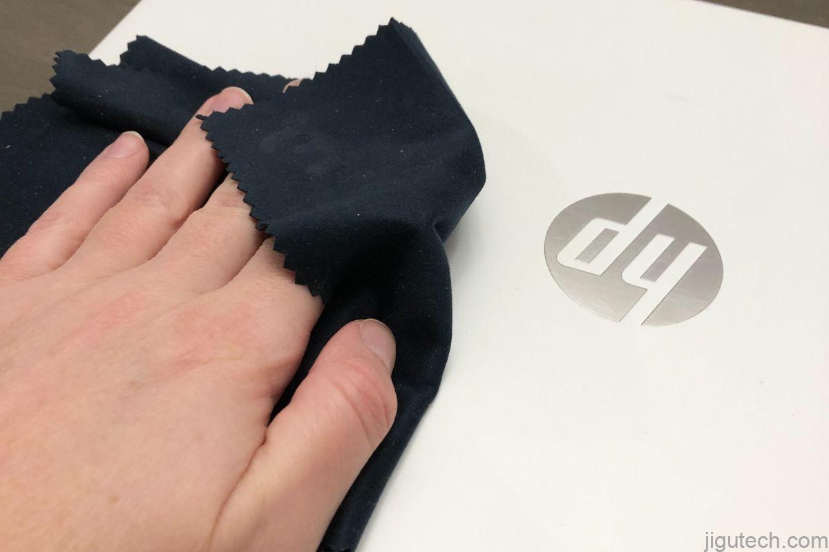 Wipe the laptop down with a microfiber cloth